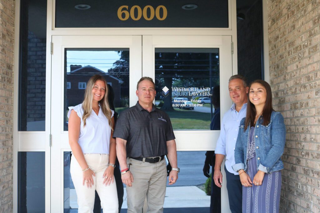 our team standing by the office door